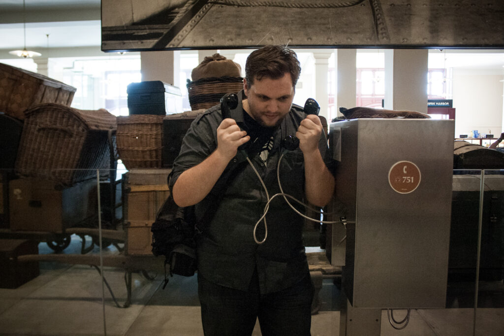 Jimmy playing with a couple of payphones at Ellis Island.